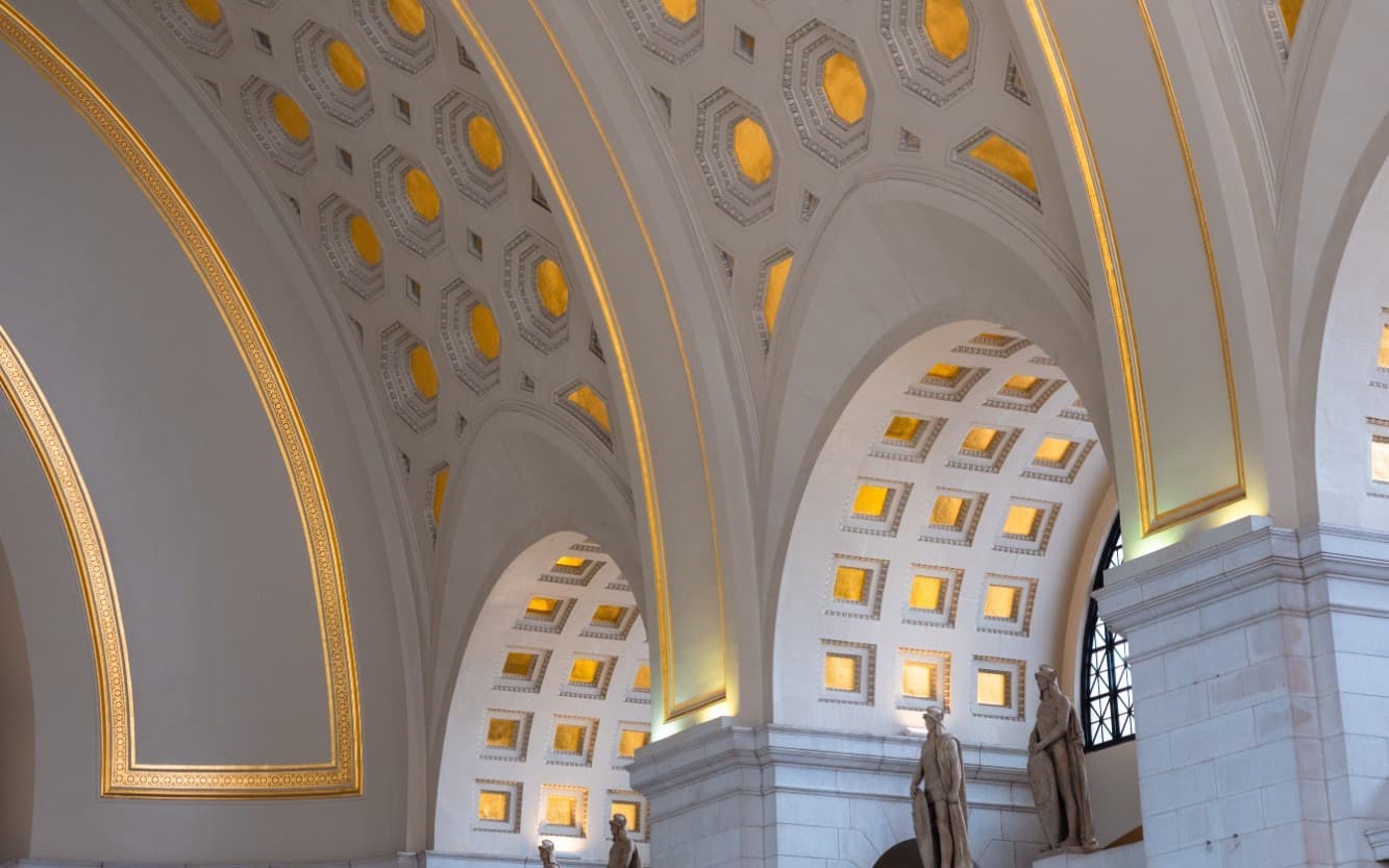 Gilded coffered arches of a grand hall in Washington, D.C.
